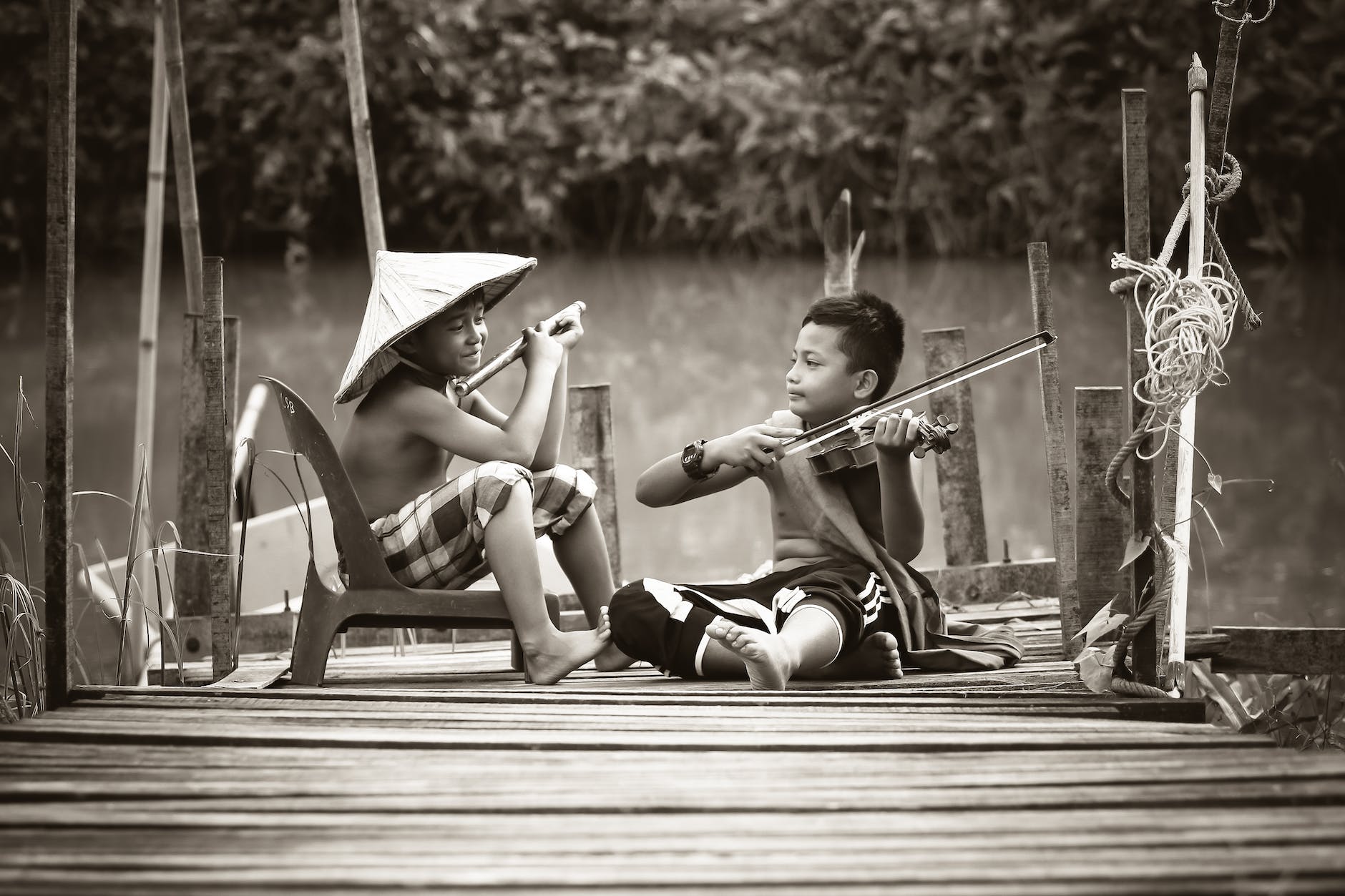 two boys playing music instruments